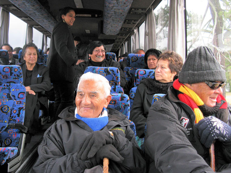 Kaumatua and others inside a bus.