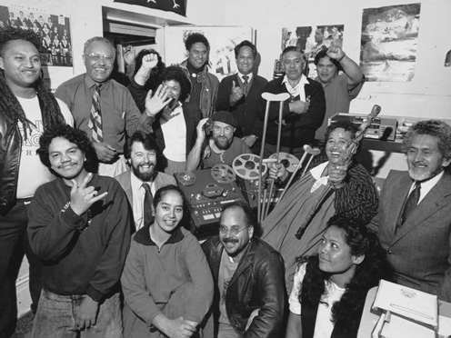 Group crowded into radio station.