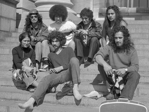 Group of young Māori on steps of Parliament.